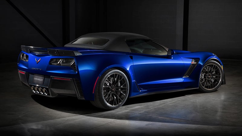 A Midnight Blue 2019 Chevrolet Corvette in a dimly lit shop. - Jim Turner Chevrolet McGregor, TX