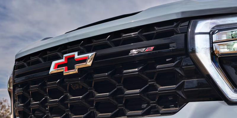 The grill of an all-new silver 2025 Chevrolet Silverado HD.